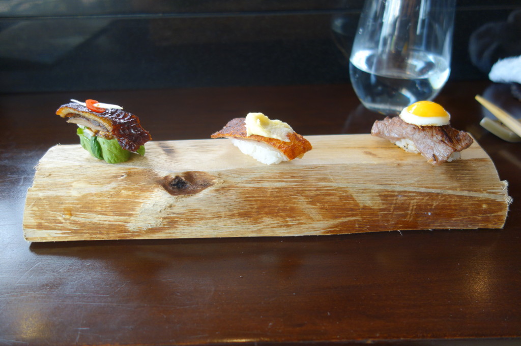 Unconventional nigiri: quail egg + beef, pancetta, peking duck