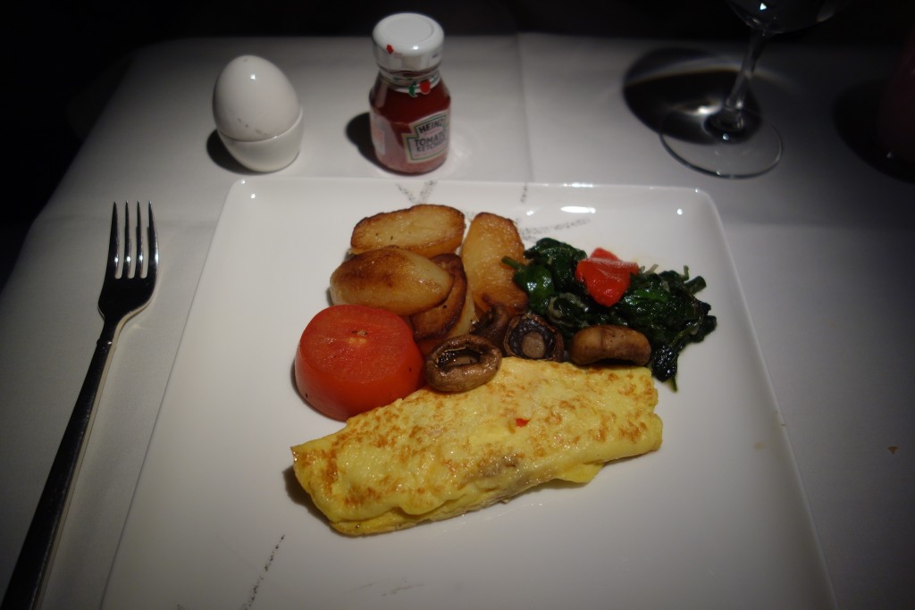 VGML breakfast of a cheeses omelet with peppers, onions, and sides of spinach, tomato, potatoes, and mushrooms