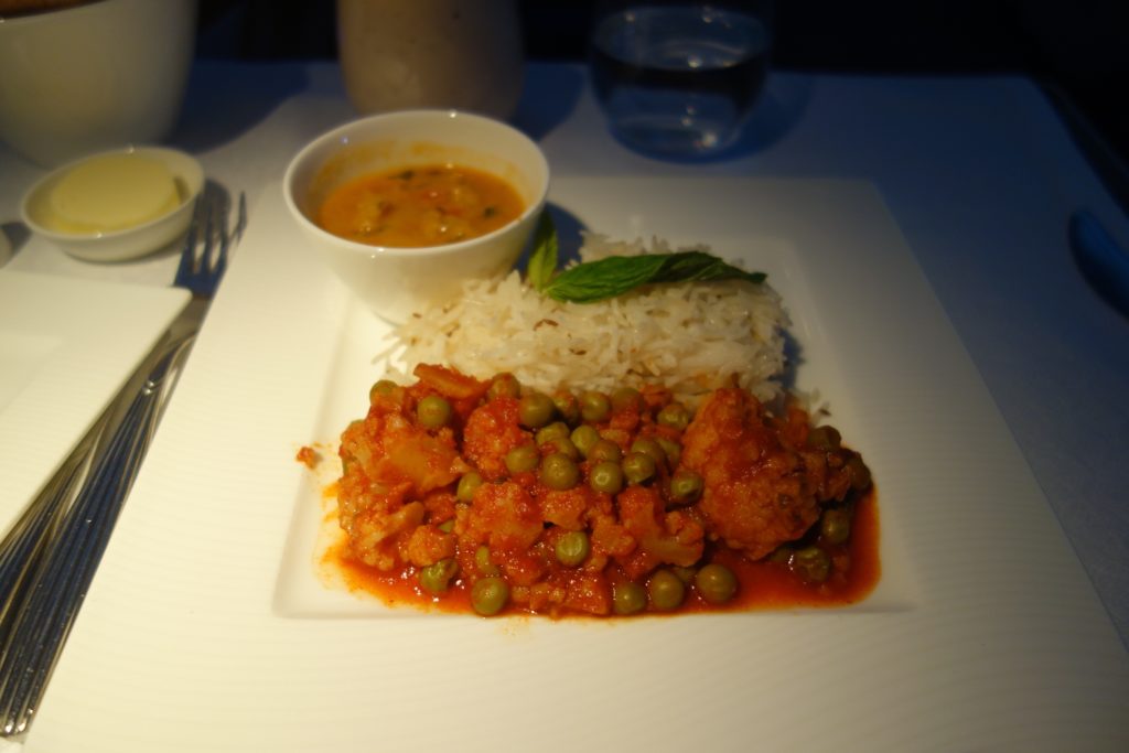 Jain vegetarian meal of peas and cauliflower, rice, and potato sauce