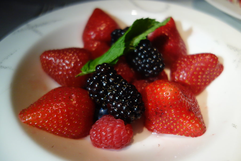a bowl of strawberries and blackberries