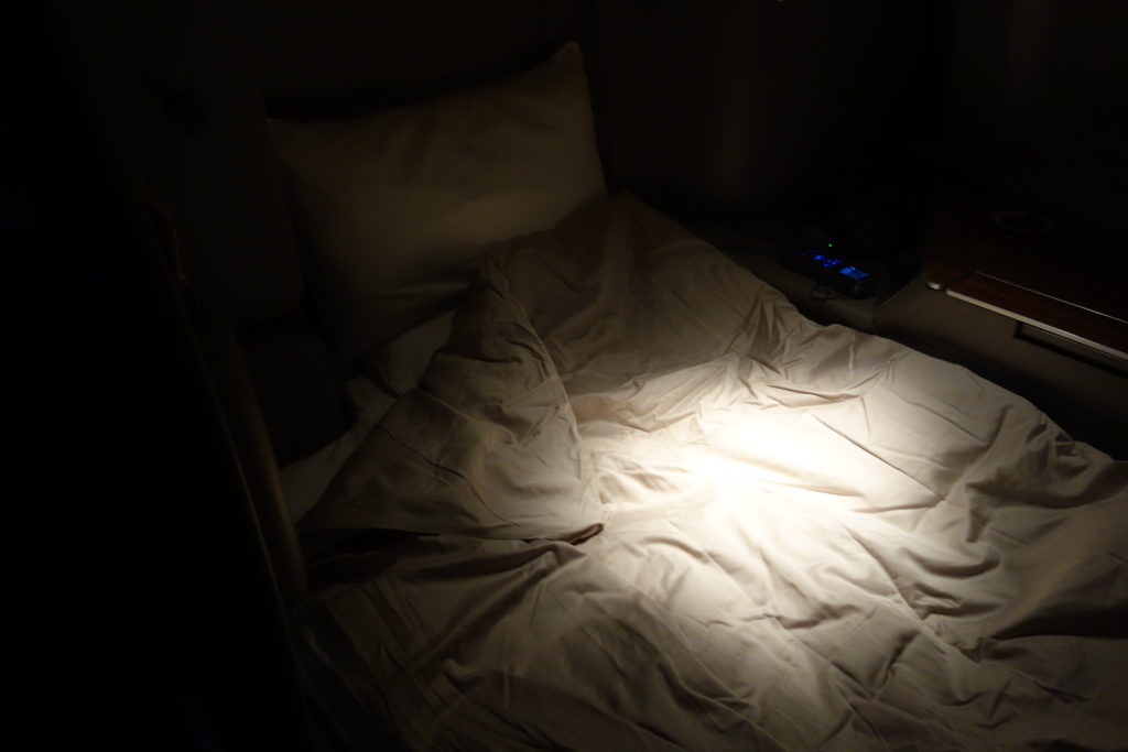 a bed with a light on it