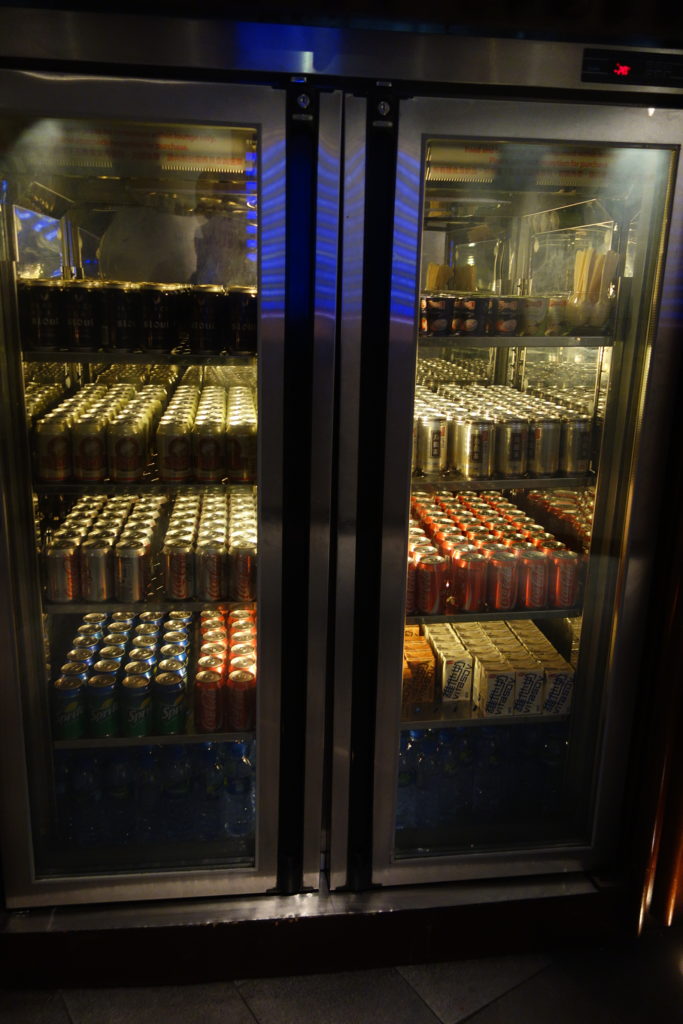 a refrigerator full of cans and beer