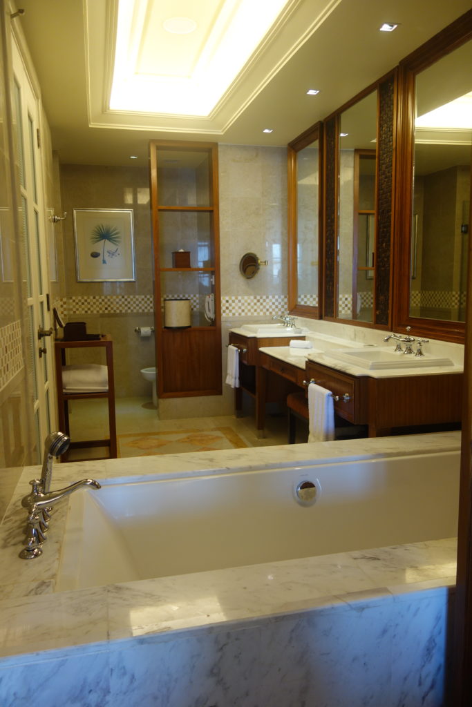 a bathroom with marble countertops and sinks
