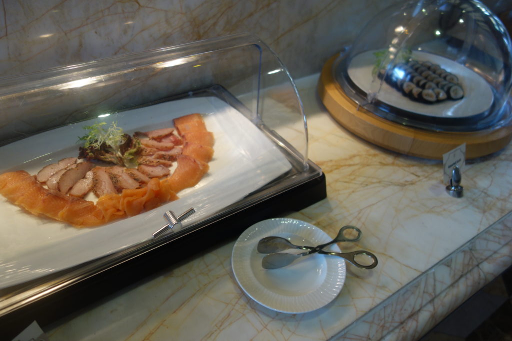 food in a glass case on a counter