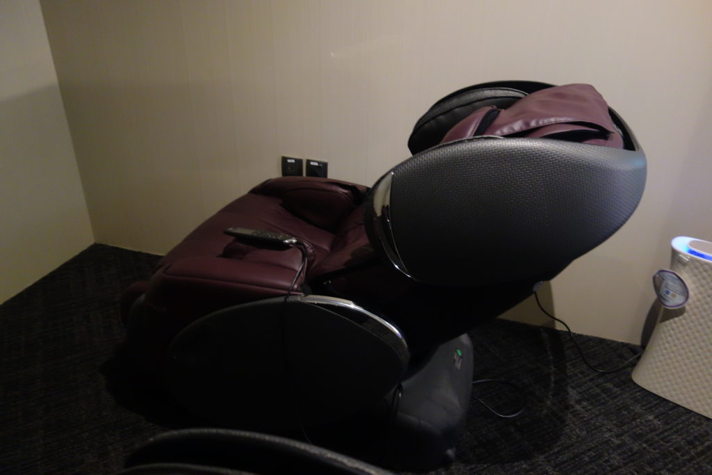 a massage chair with a black cushion