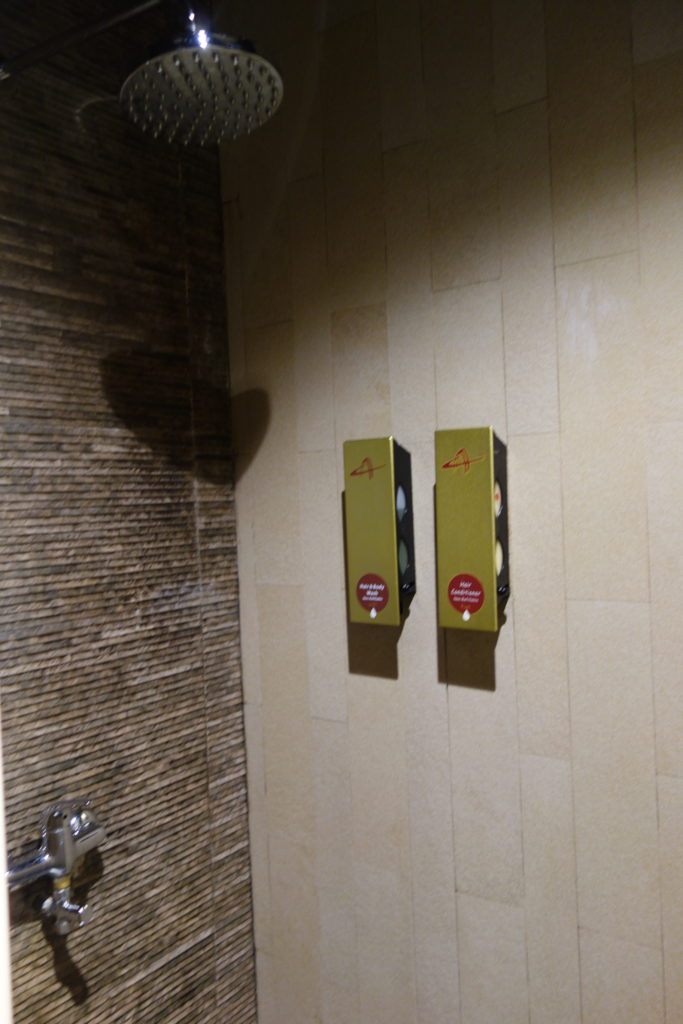 a two dispensers on a wall