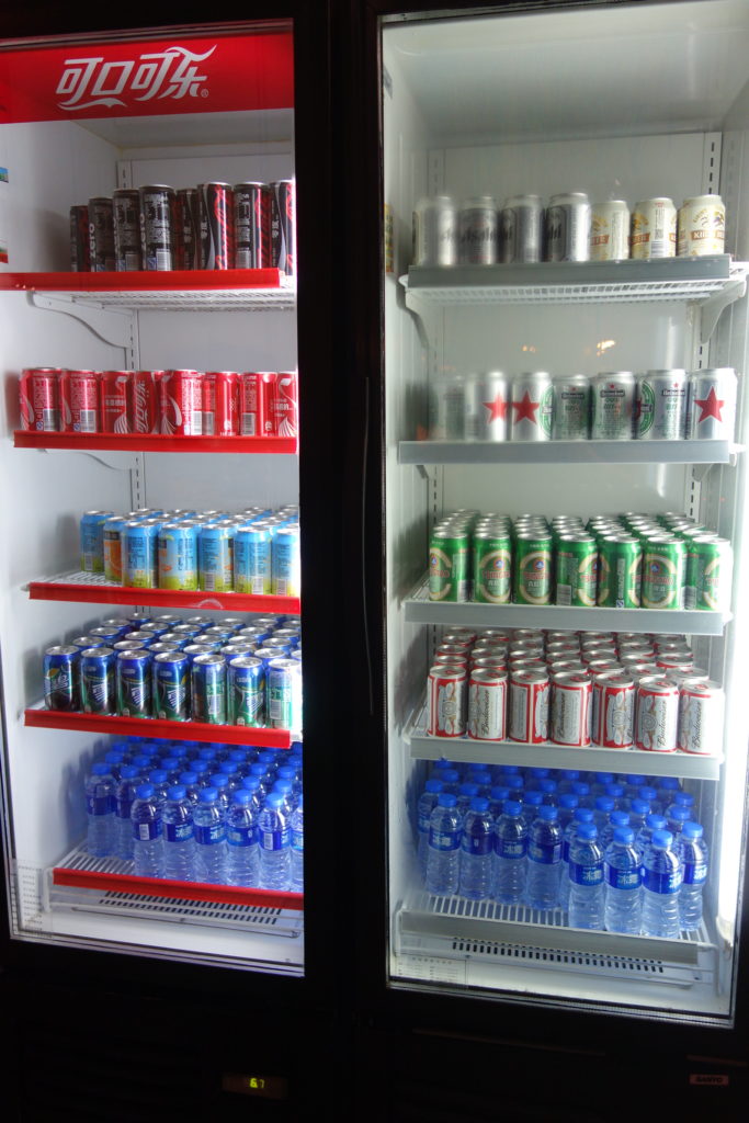 a refrigerator full of cans and bottles