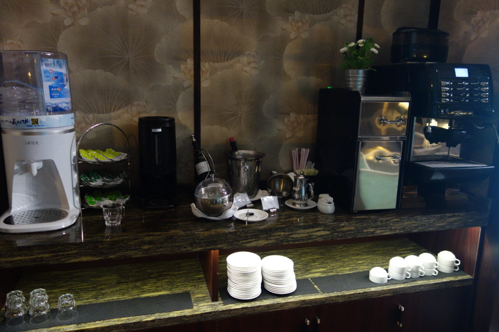 a counter with plates and cups on it