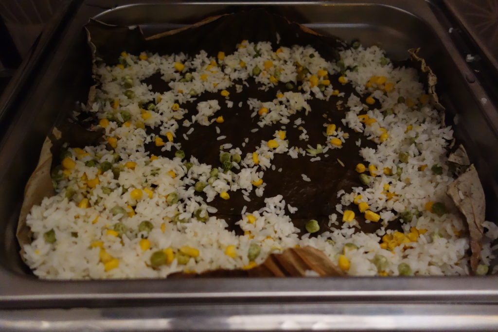a tray of rice and corn