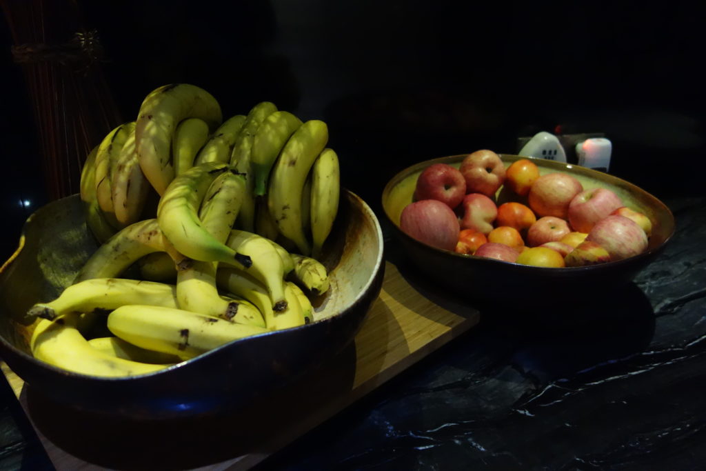 bowls of fruit on a counter