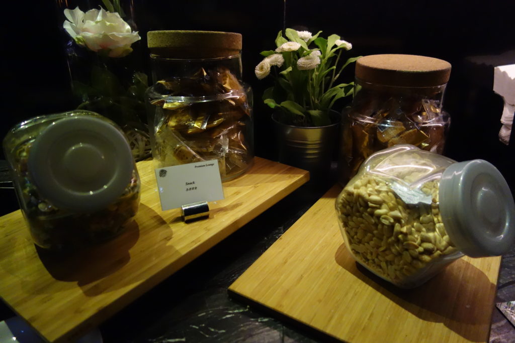 a group of jars of food on a wood surface