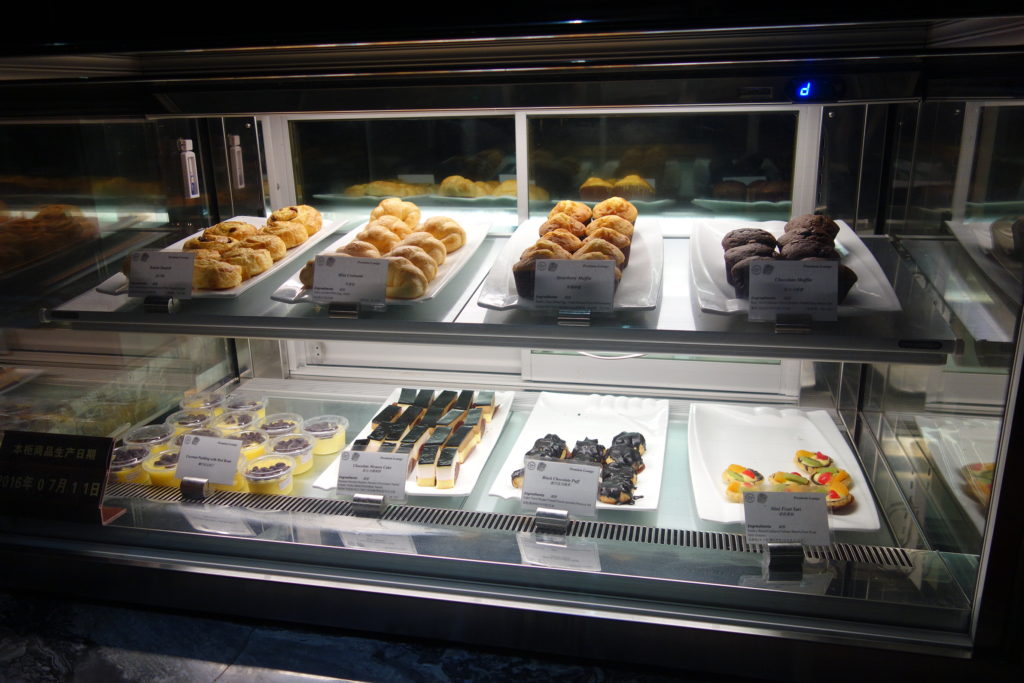 a display case with pastries and desserts