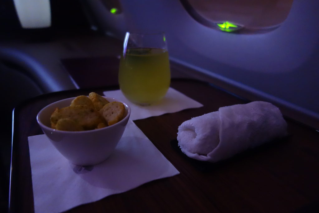 a bowl of crackers and a towel on a table