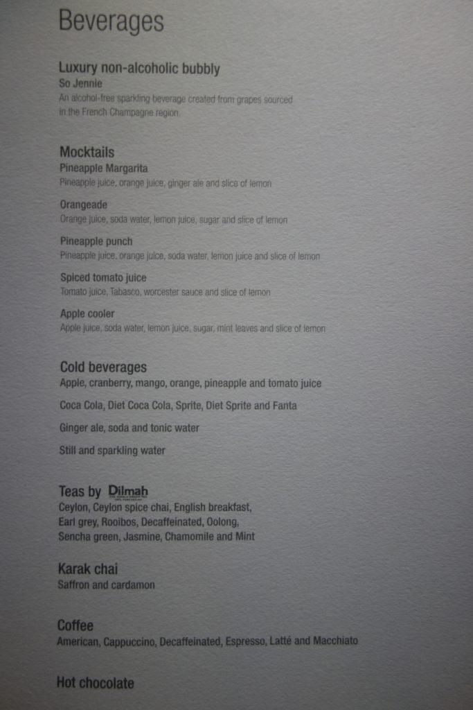 a menu of drinks on a white surface