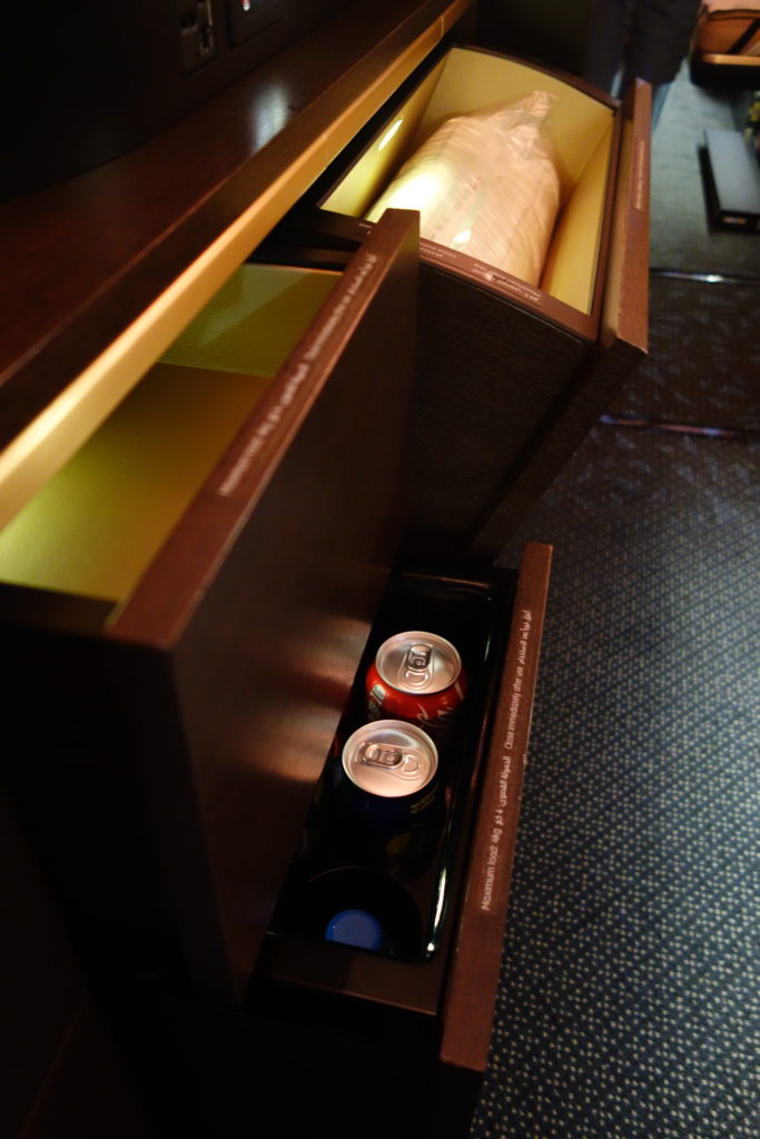 a drawer with cans in it