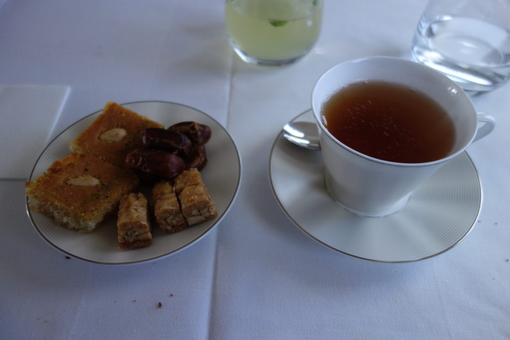 a plate of food and a cup of tea