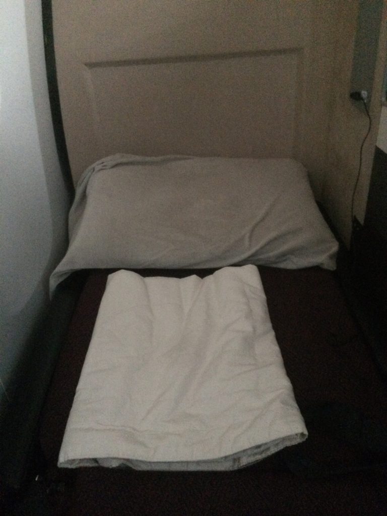 a bed with a white blanket