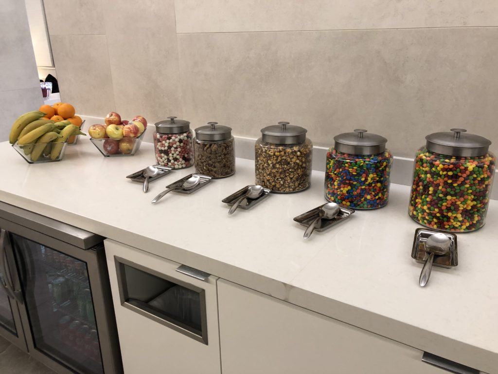 a row of candy containers on a counter