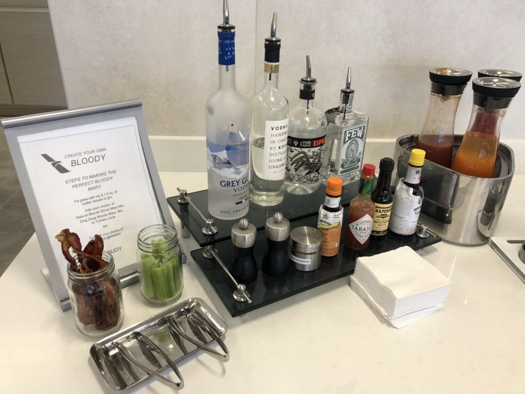 a table with bottles of liquid and a menu
