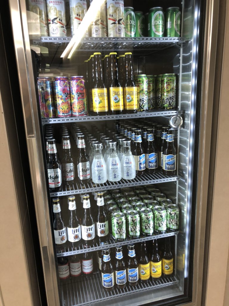 a refrigerator full of beer and cans