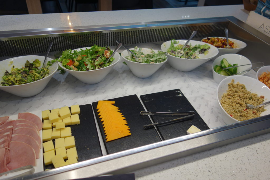 a salad bar with different types of food