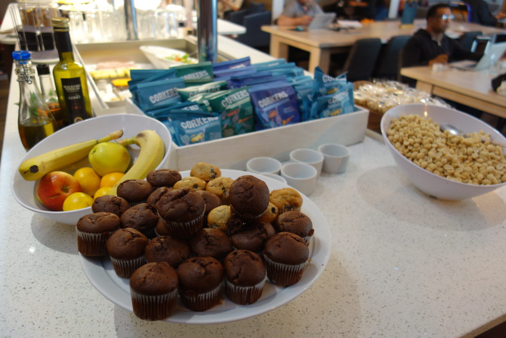 a plate of muffins and fruit on a table