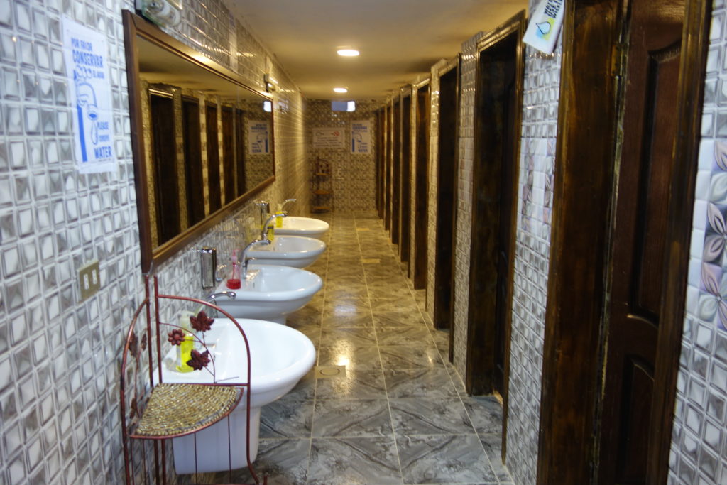 a bathroom with sinks and mirrors