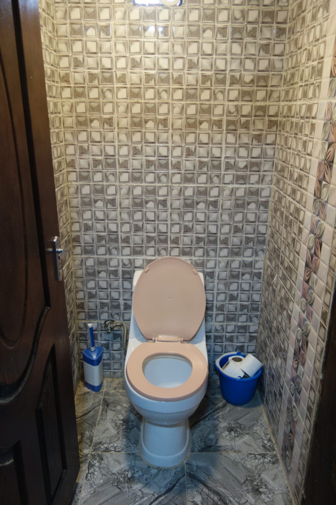 a toilet with a lid up