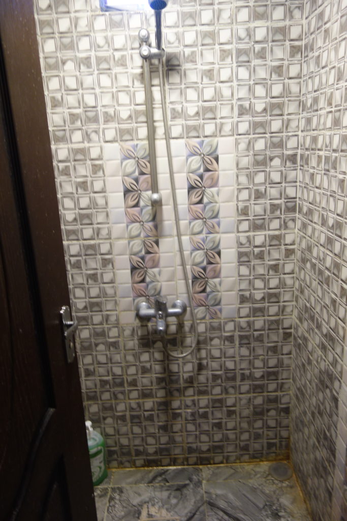 a shower with a shower head