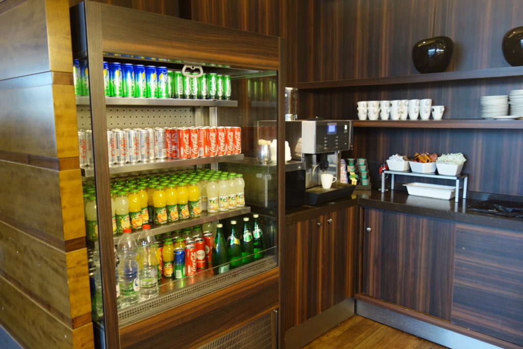 a shelf with drinks and beverages on it