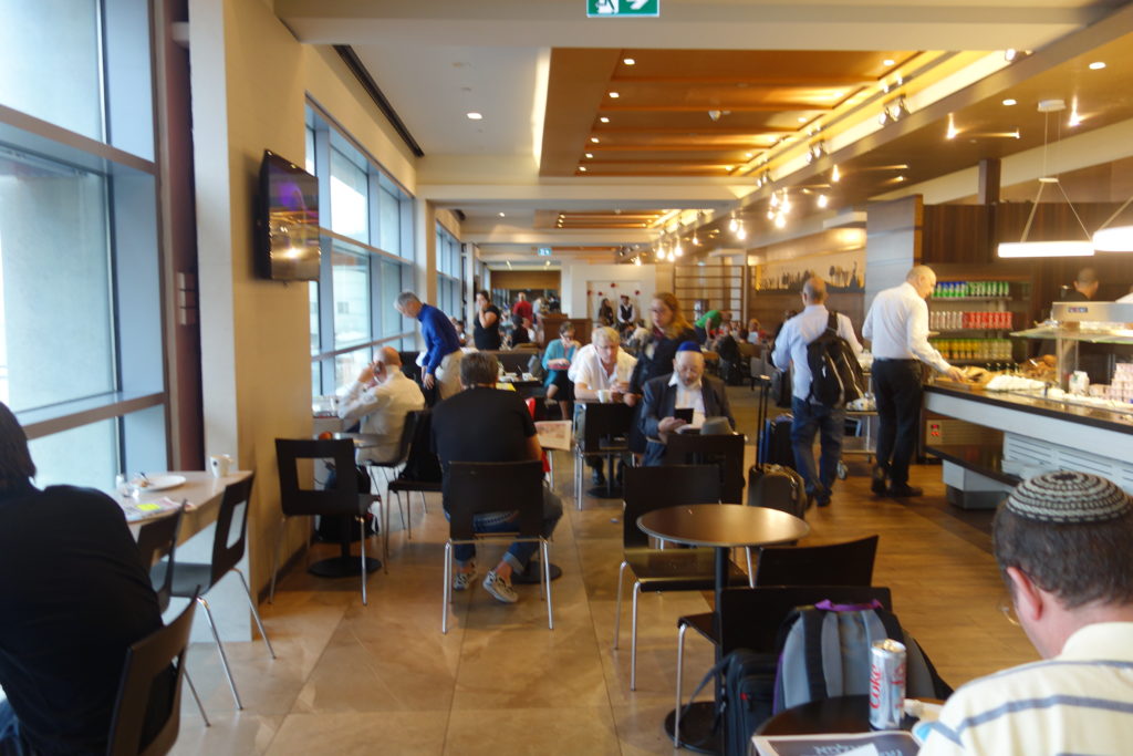 a group of people sitting at tables in a room