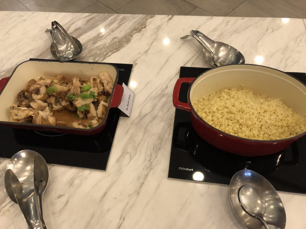 a bowl of rice and chicken on a table