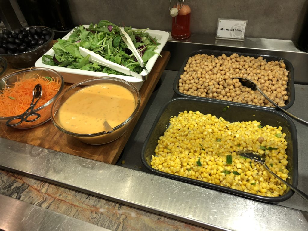 a trays of food on a counter