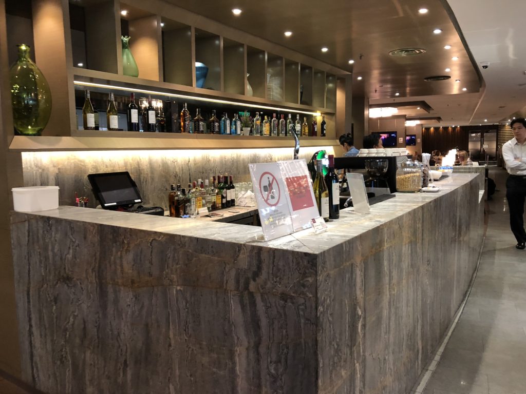 a bar with bottles of liquor on the counter