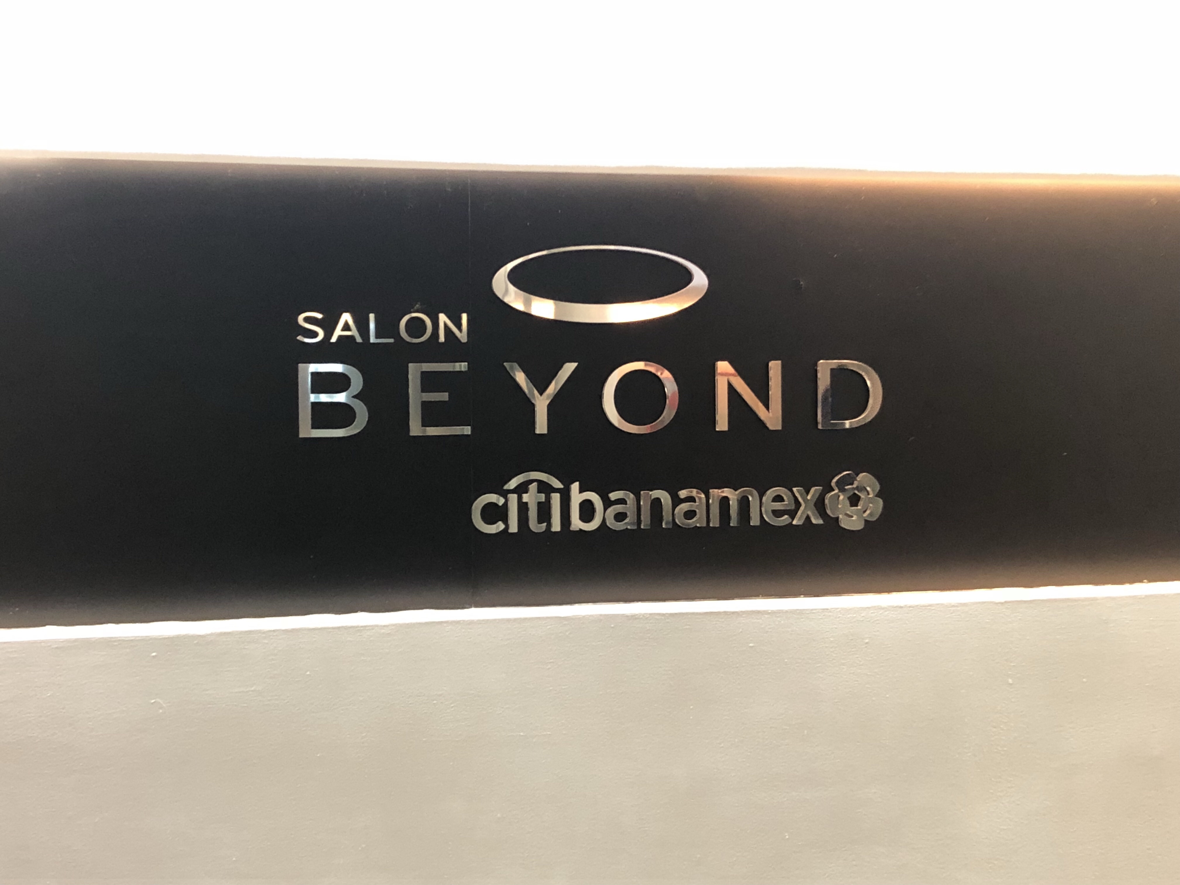 a sign with silver text on it