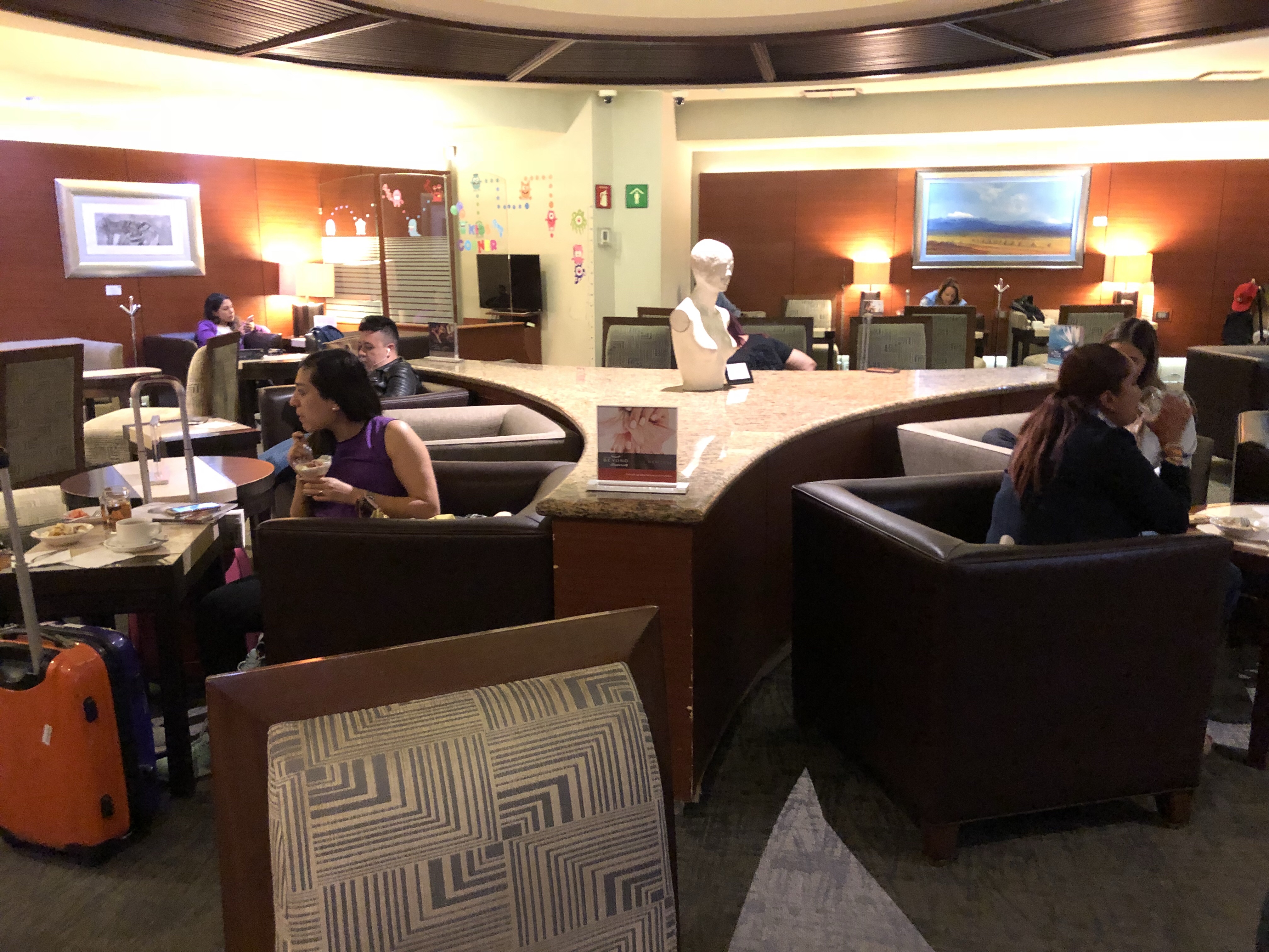 a group of people sitting at tables in a room