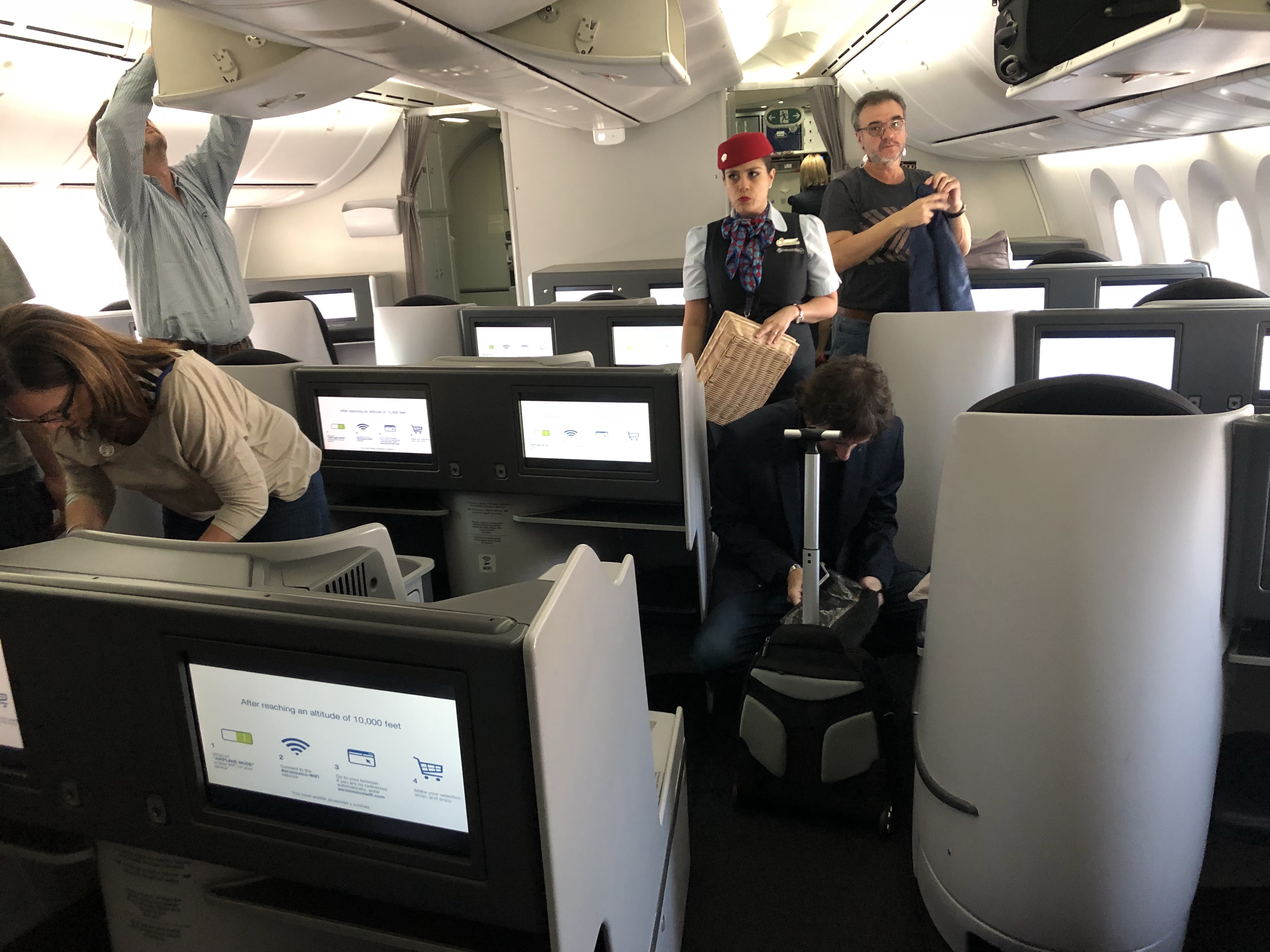 people in an airplane with people in the back