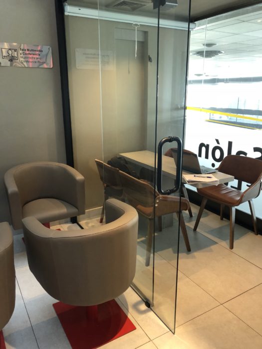 a glass door with a table and chairs